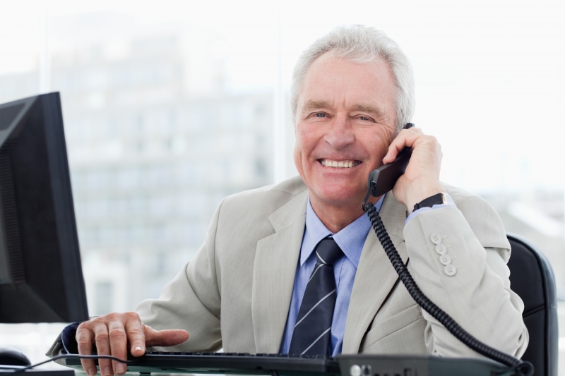 3608760-smiling-senior-manager-on-the-phone